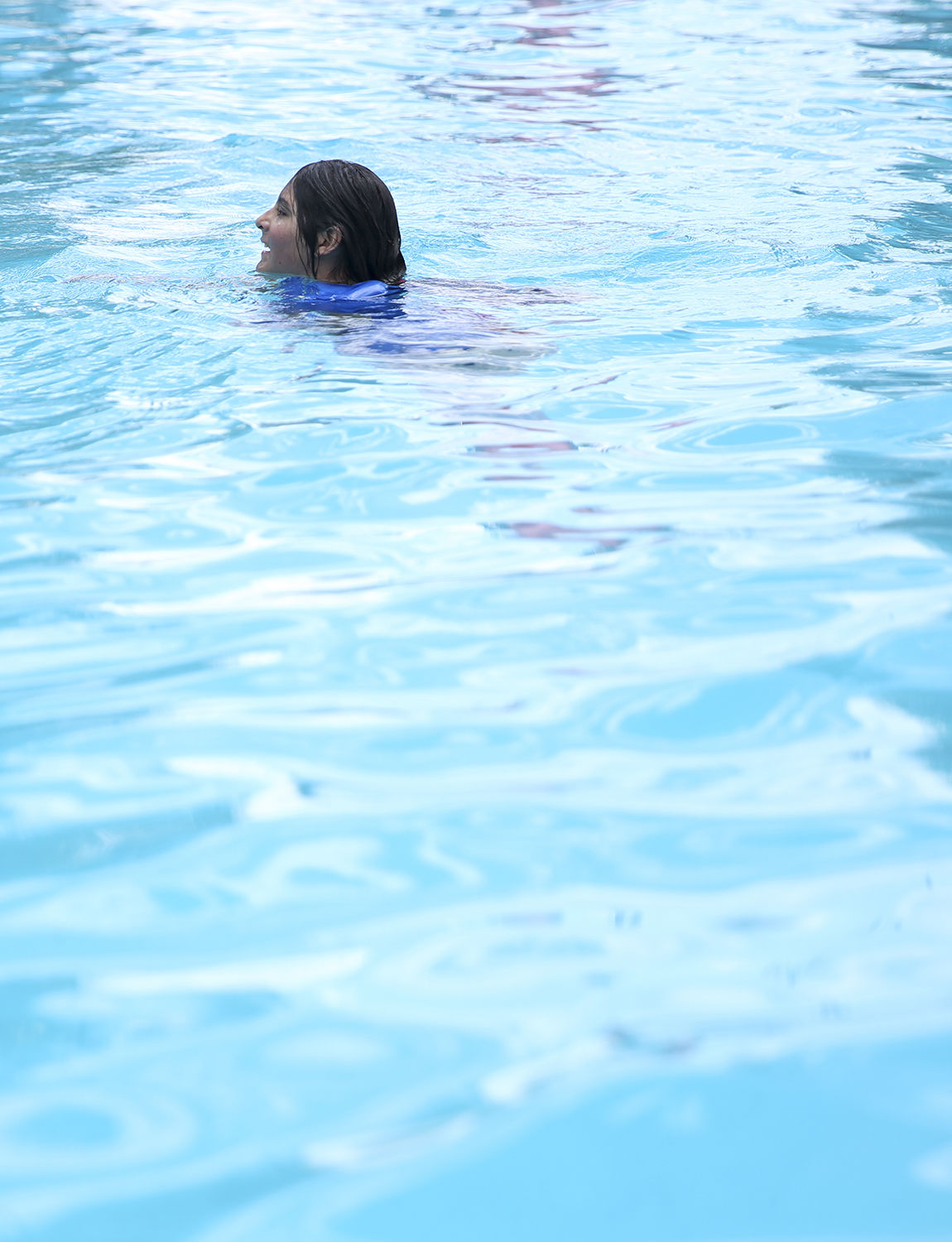 Lori Leach, 12, treads water in the deep end of the pool